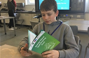 A boy reading a book
