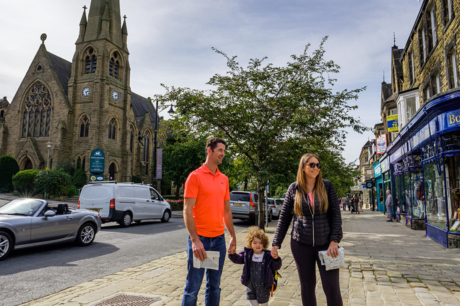 Man, woman and child on a Bradford street