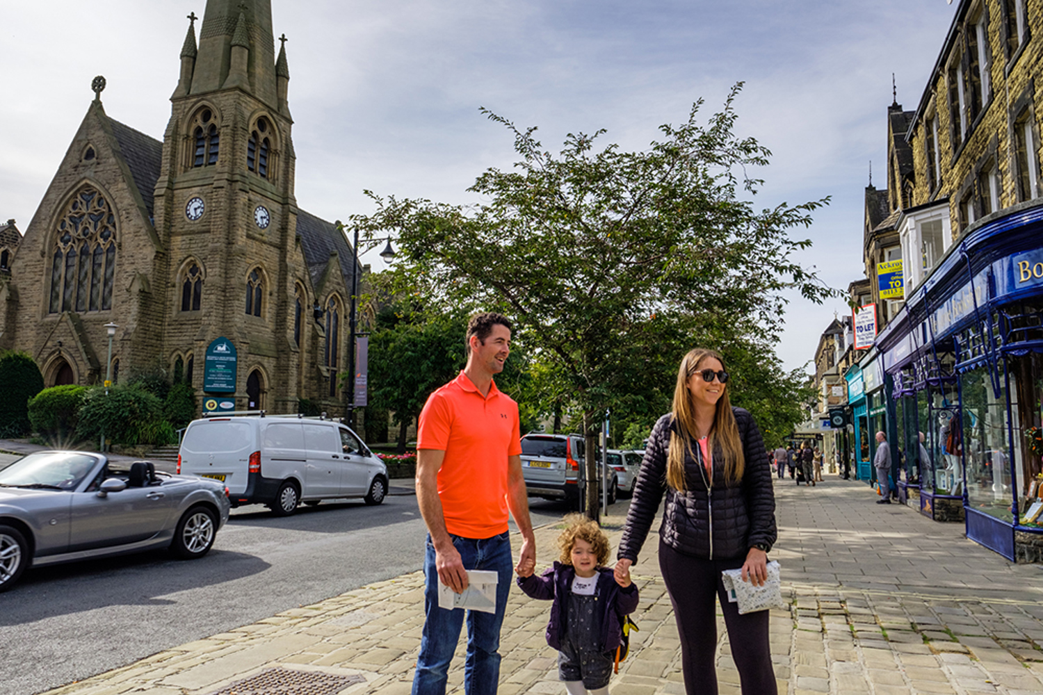 Man, woman and child on a Bradford street