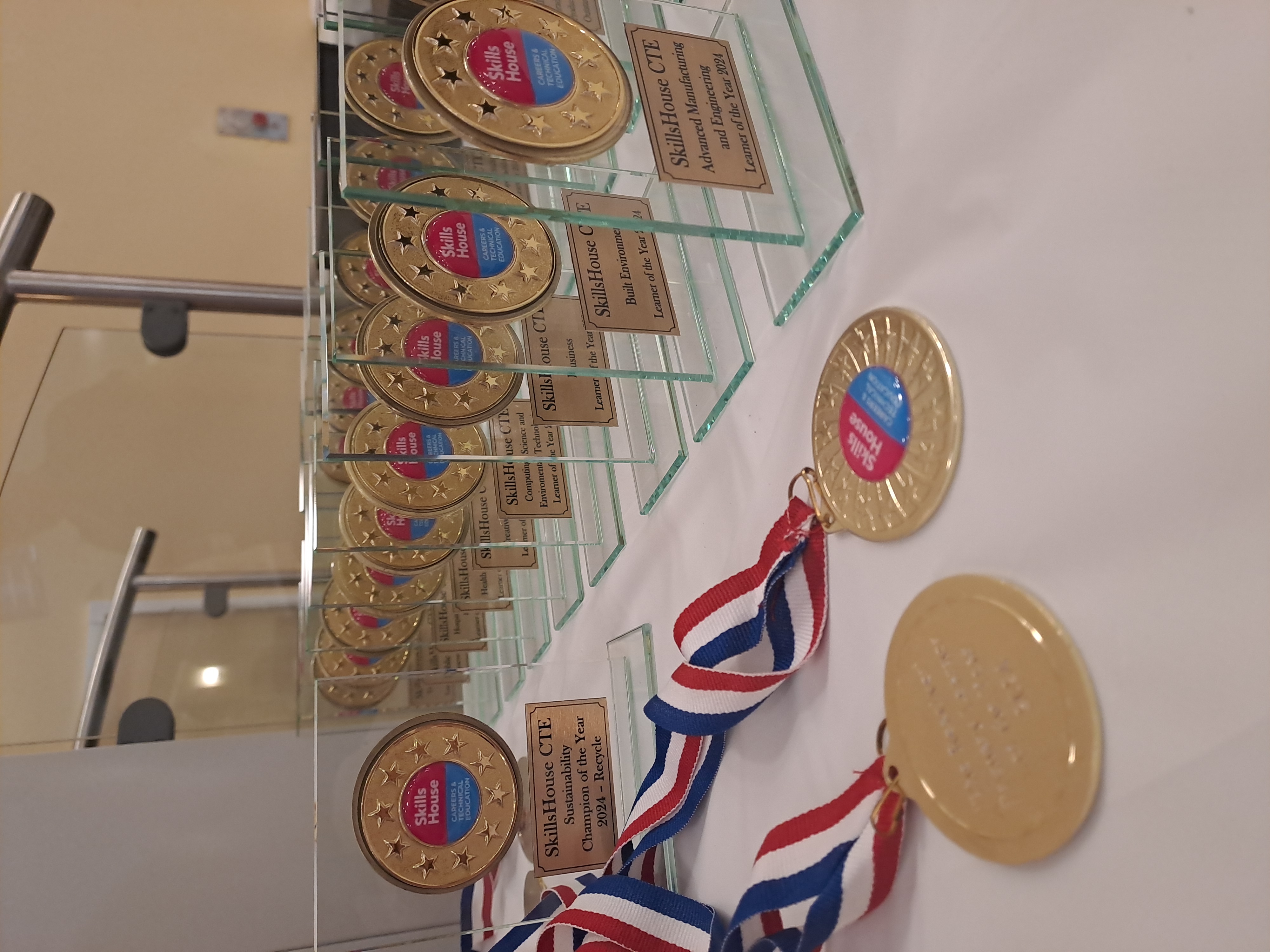 A collection of awards trophies and medals