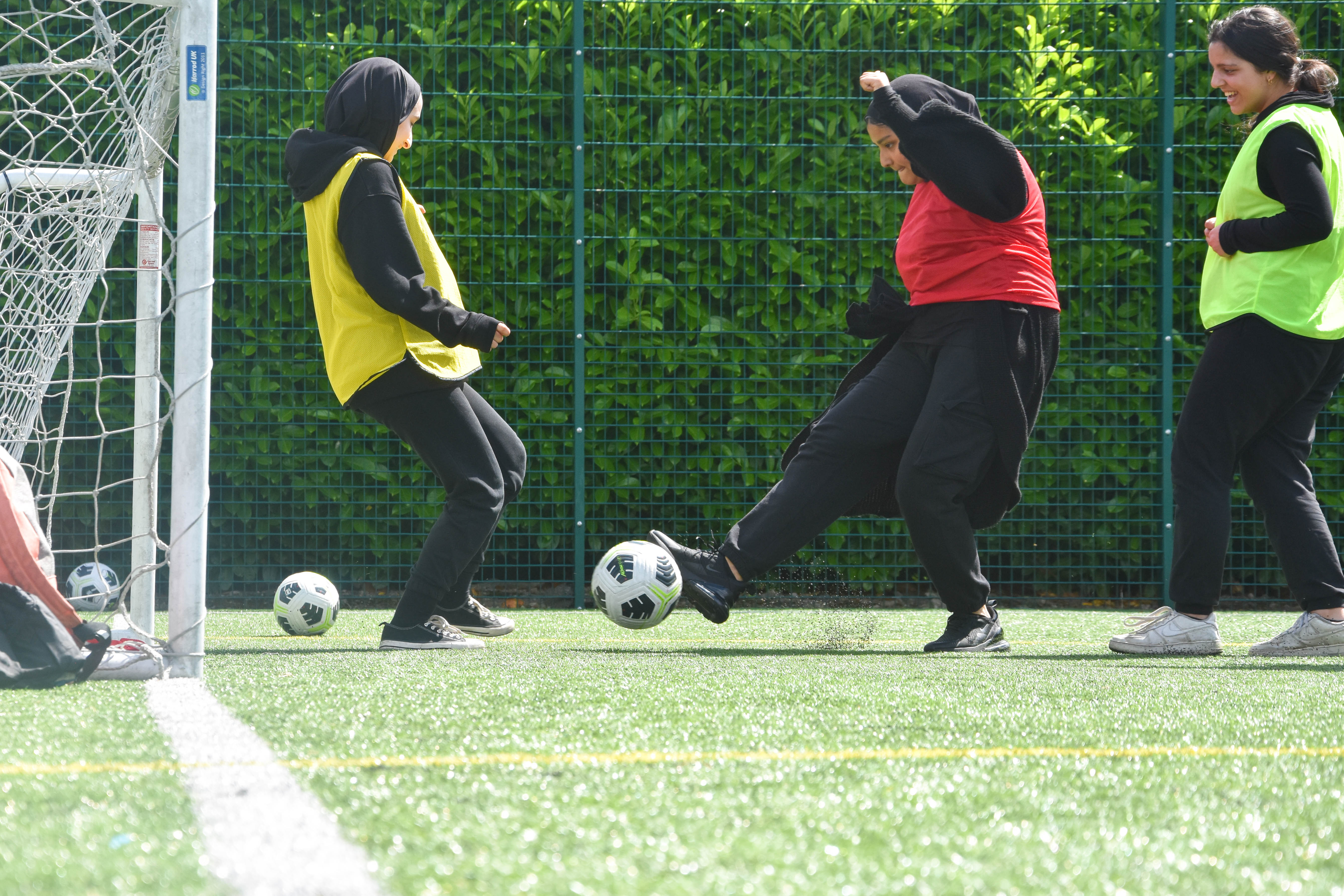 A group of girls playing football