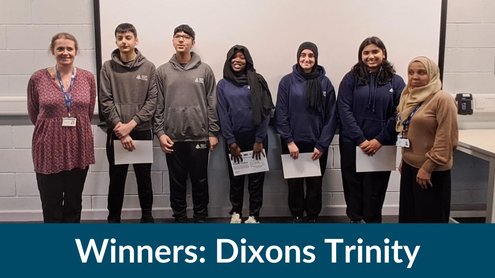 A group of students holding certificates