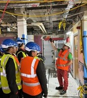 A group of young people wearing high vis jackets